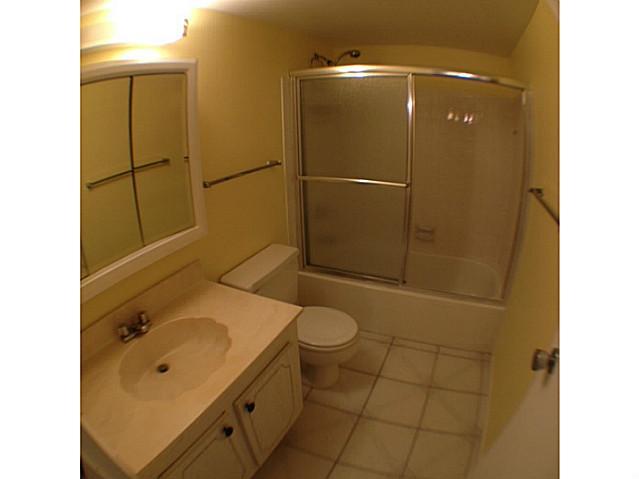 2950 Southeast Ocean Boulevard, Unit 1357 Stuart, FL 34996 - Photo 13 of 25 a bathroom with a sink toilet and shower