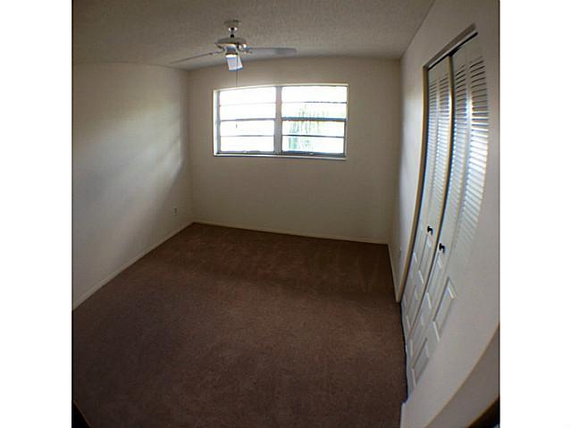 2950 Southeast Ocean Boulevard, Unit 1357 Stuart, FL 34996 - Photo 14 of 25 a view of empty room with windows
