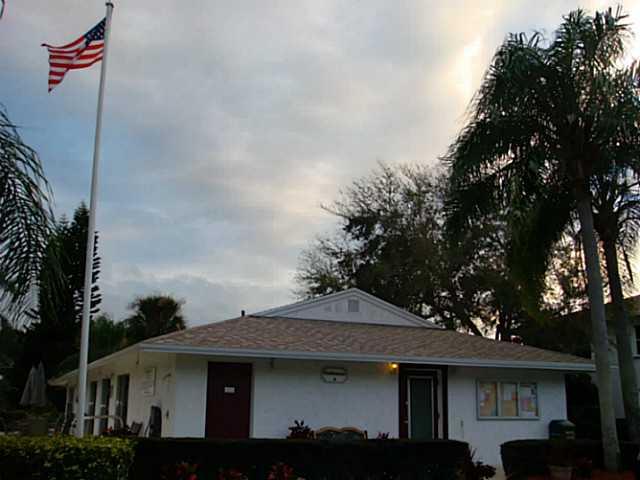 2950 Southeast Ocean Boulevard, Unit 1357 Stuart, FL 34996 - Photo 16 of 25 a front view of a house with a street