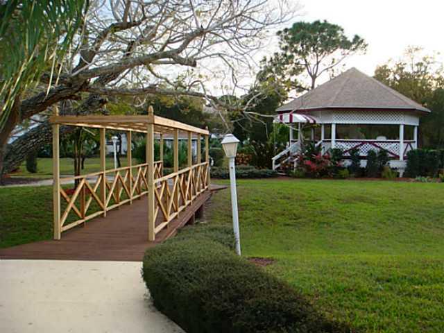 2950 Southeast Ocean Boulevard, Unit 1357 Stuart, FL 34996 - Photo 17 of 25 a view of a house with backyard and porch