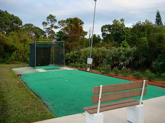2950 Southeast Ocean Boulevard, Unit 1357 Stuart, FL 34996 - Photo 20 of 25 a view of a bench in the garden