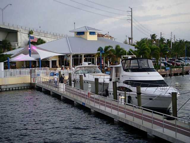 2950 Southeast Ocean Boulevard, Unit 1357 Stuart, FL 34996 - Photo 23 of 25 a view of a house with wooden deck