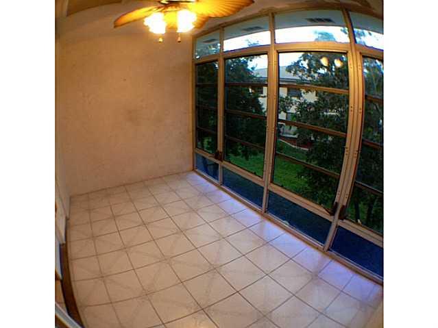 2950 Southeast Ocean Boulevard, Unit 1357 Stuart, FL 34996 - Photo 8 of 25 a view of an empty room with a balcony