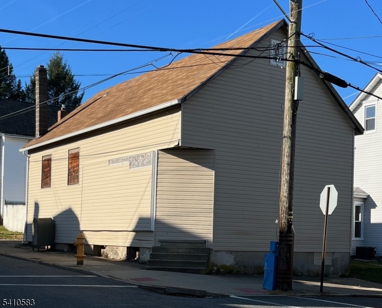 a view of a house with a street
