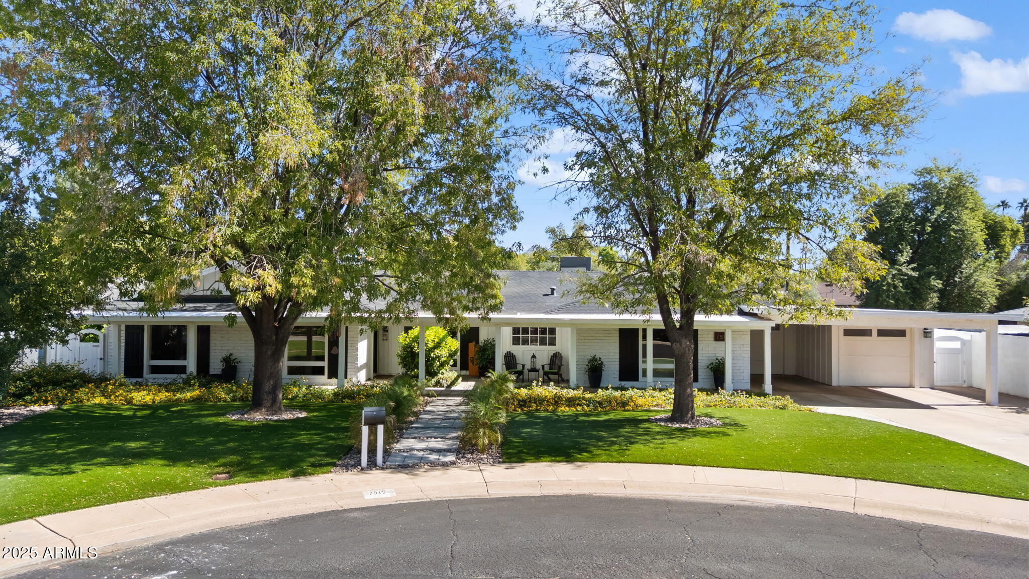 a front view of a house with a yard and porch