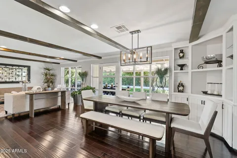 a view of a dining room with furniture window and outside view