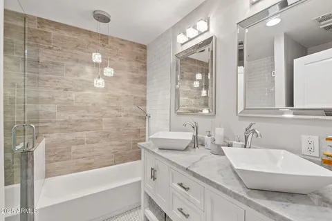 a bathroom with a bathtub and a shower