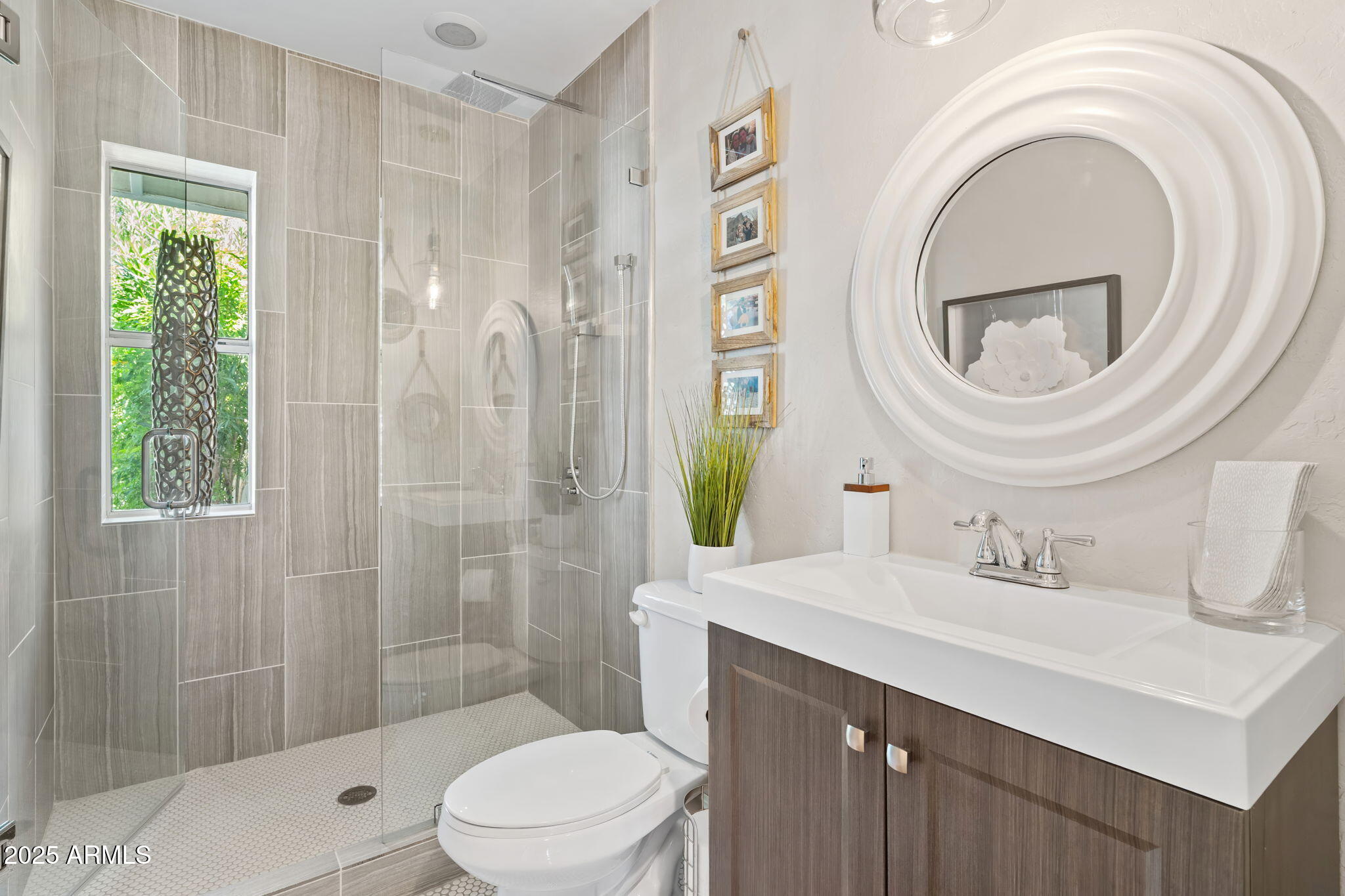 7519 North 12th Avenue Phoenix, AZ 85021 - Photo 28 of 52 a bathroom with a sink a toilet and shower