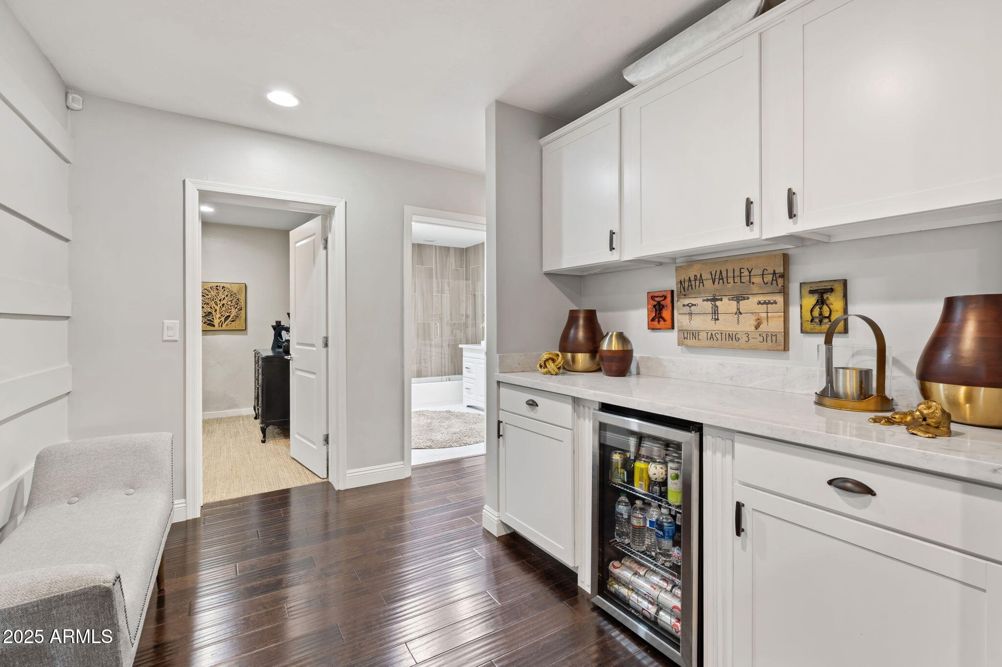 7519 North 12th Avenue Phoenix, AZ 85021 - Photo 30 of 52 a kitchen with white cabinets and wooden floor