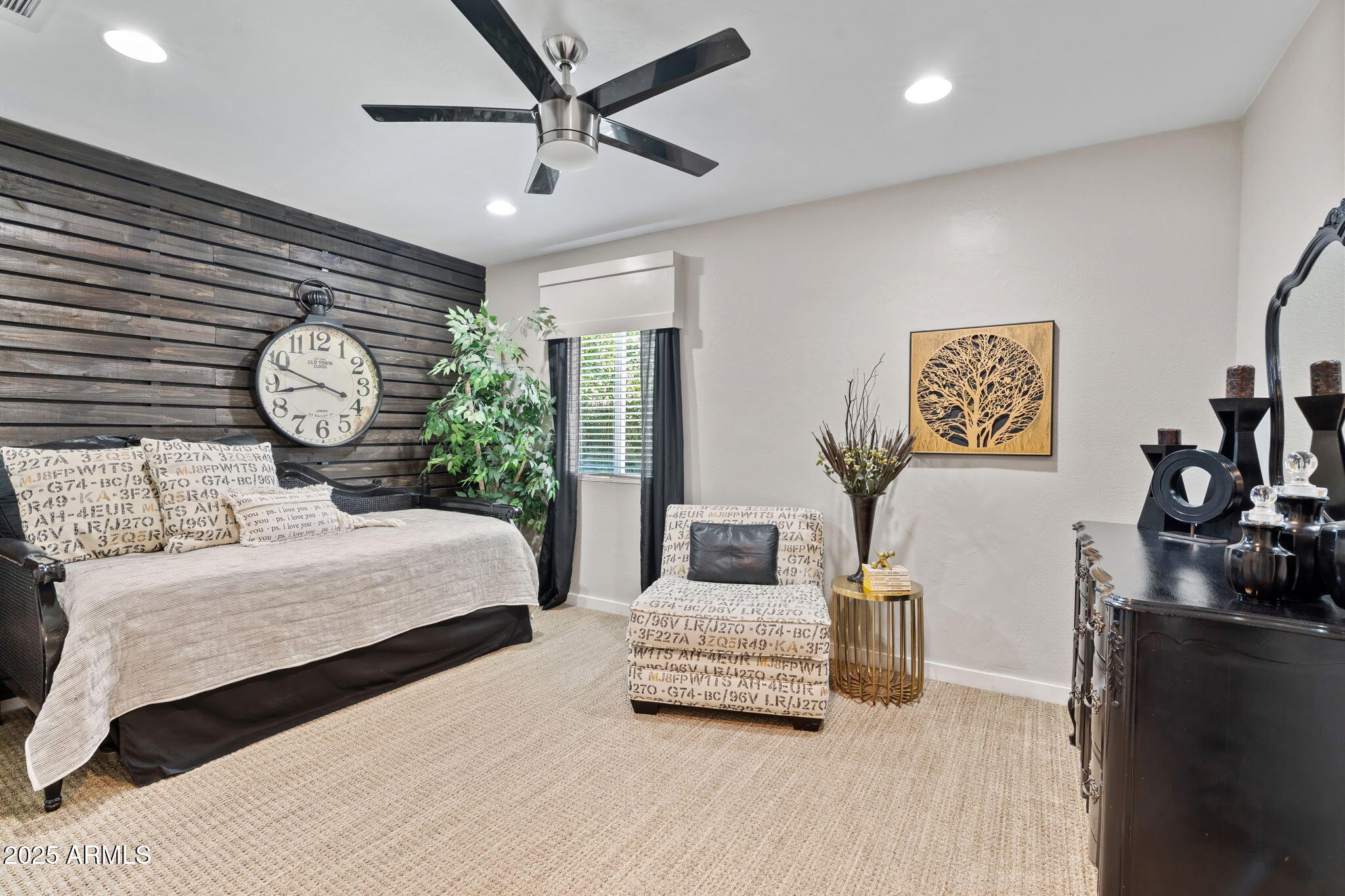 7519 North 12th Avenue Phoenix, AZ 85021 - Photo 31 of 52 a bedroom with a large bed and a chandelier