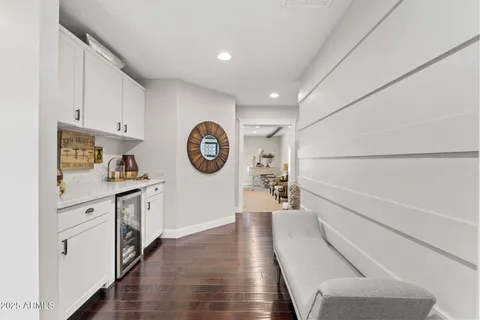 a bathroom with a sink double vanity granite tub shower and a mirror