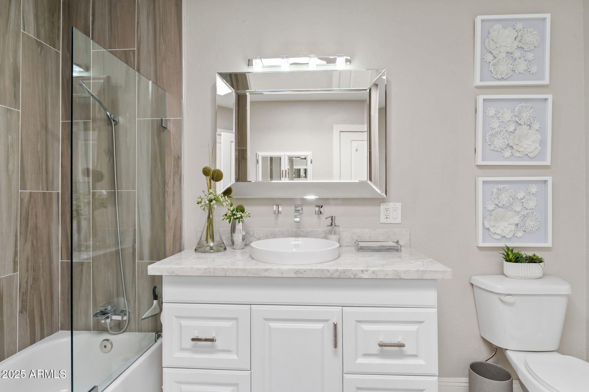 7519 North 12th Avenue Phoenix, AZ 85021 - Photo 34 of 52 a bathroom with a granite countertop sink a toilet and a mirror