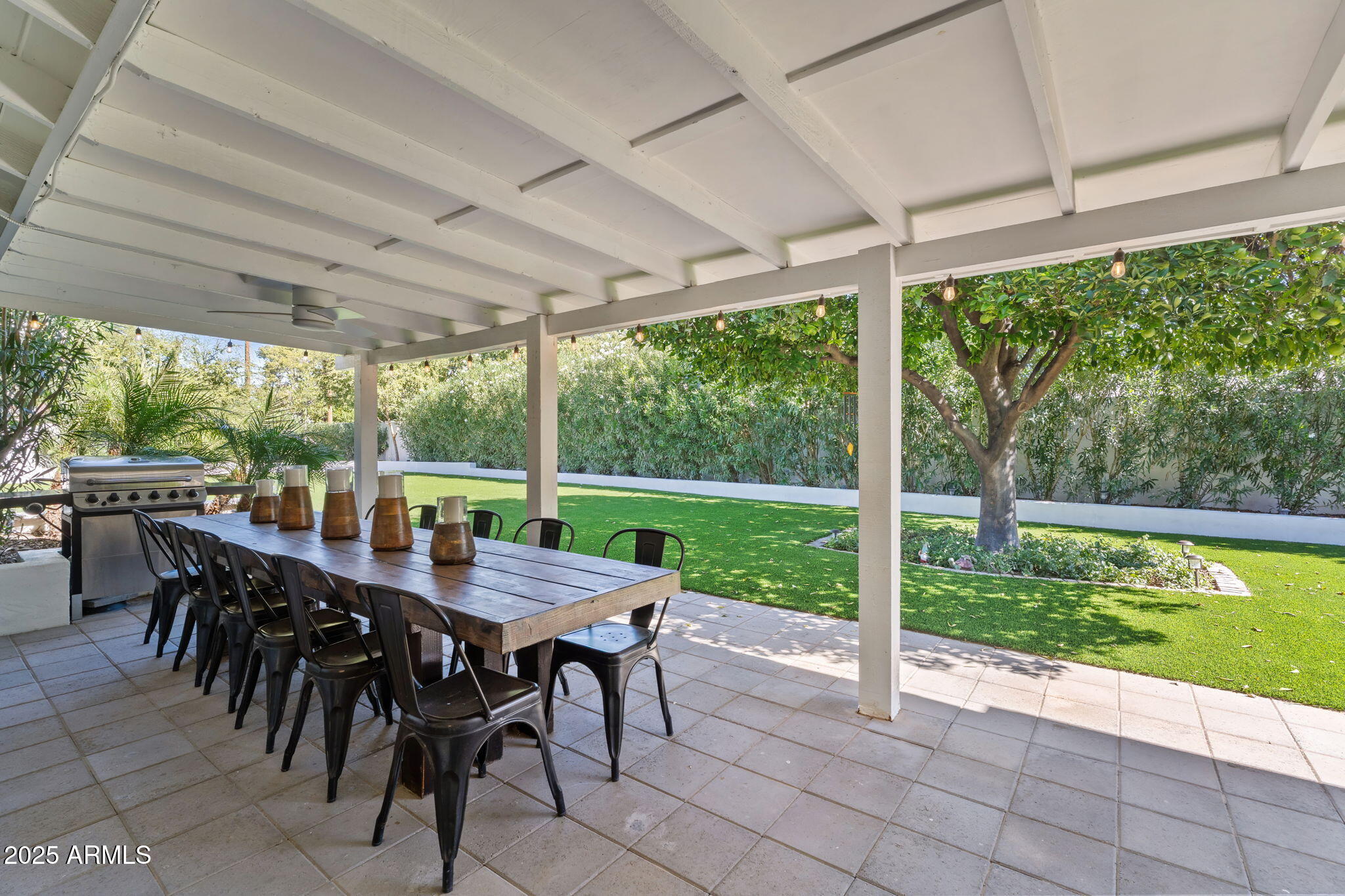 7519 North 12th Avenue Phoenix, AZ 85021 - Photo 43 of 52 a view of a patio with a table chairs and backyard