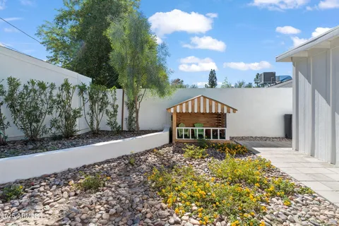 a front view of a house with garden