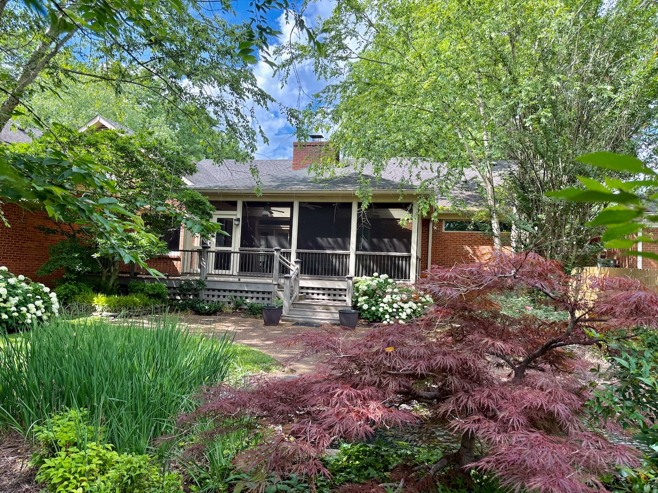 Undisclosed Address Brentwood, TN 37027 - Photo 3 of 4 a view of a house with a backyard