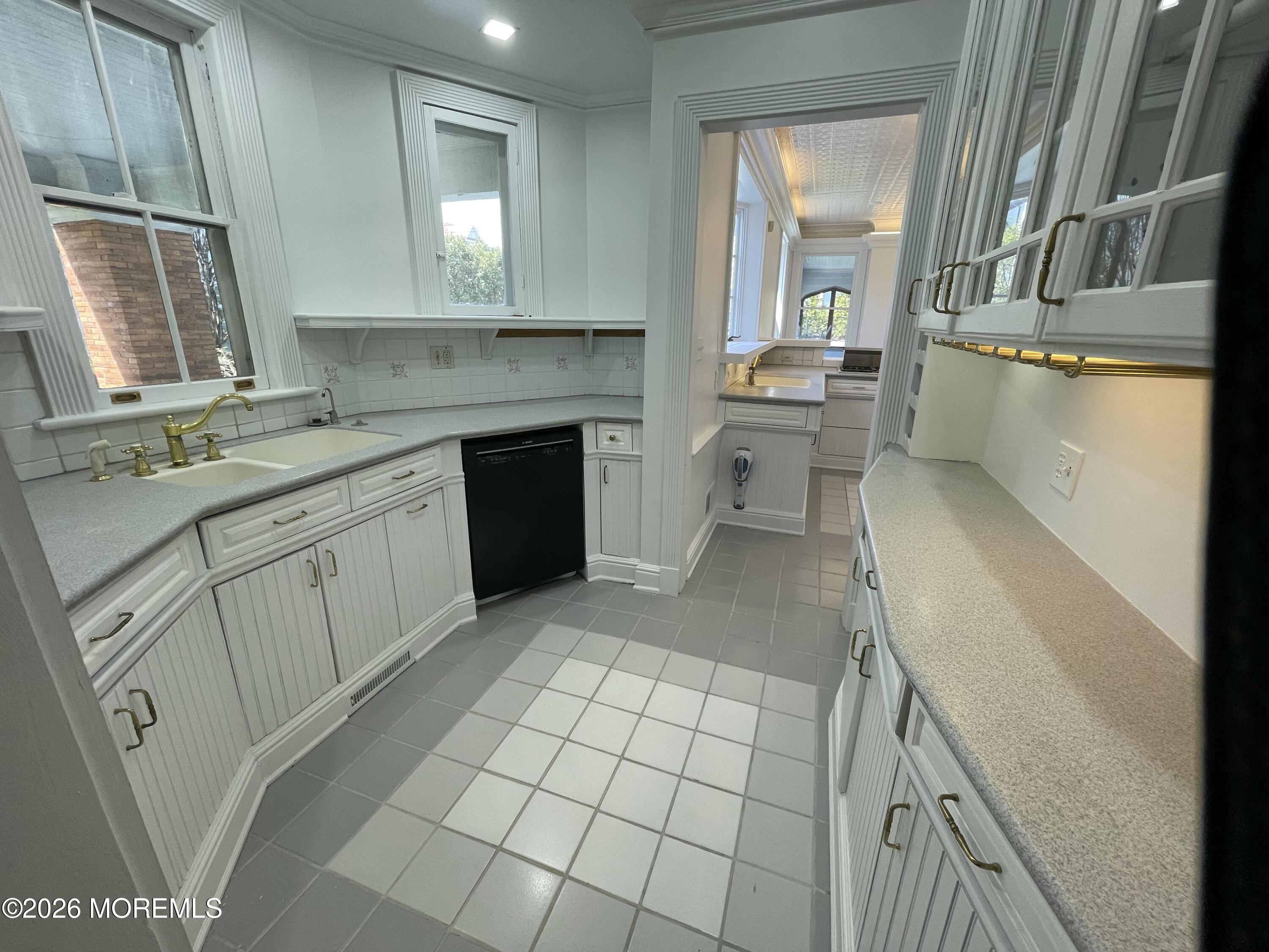 211 Cedar Avenue Allenhurst, NJ 07711 - Photo 11 of 20 a kitchen with a sink cabinets and window