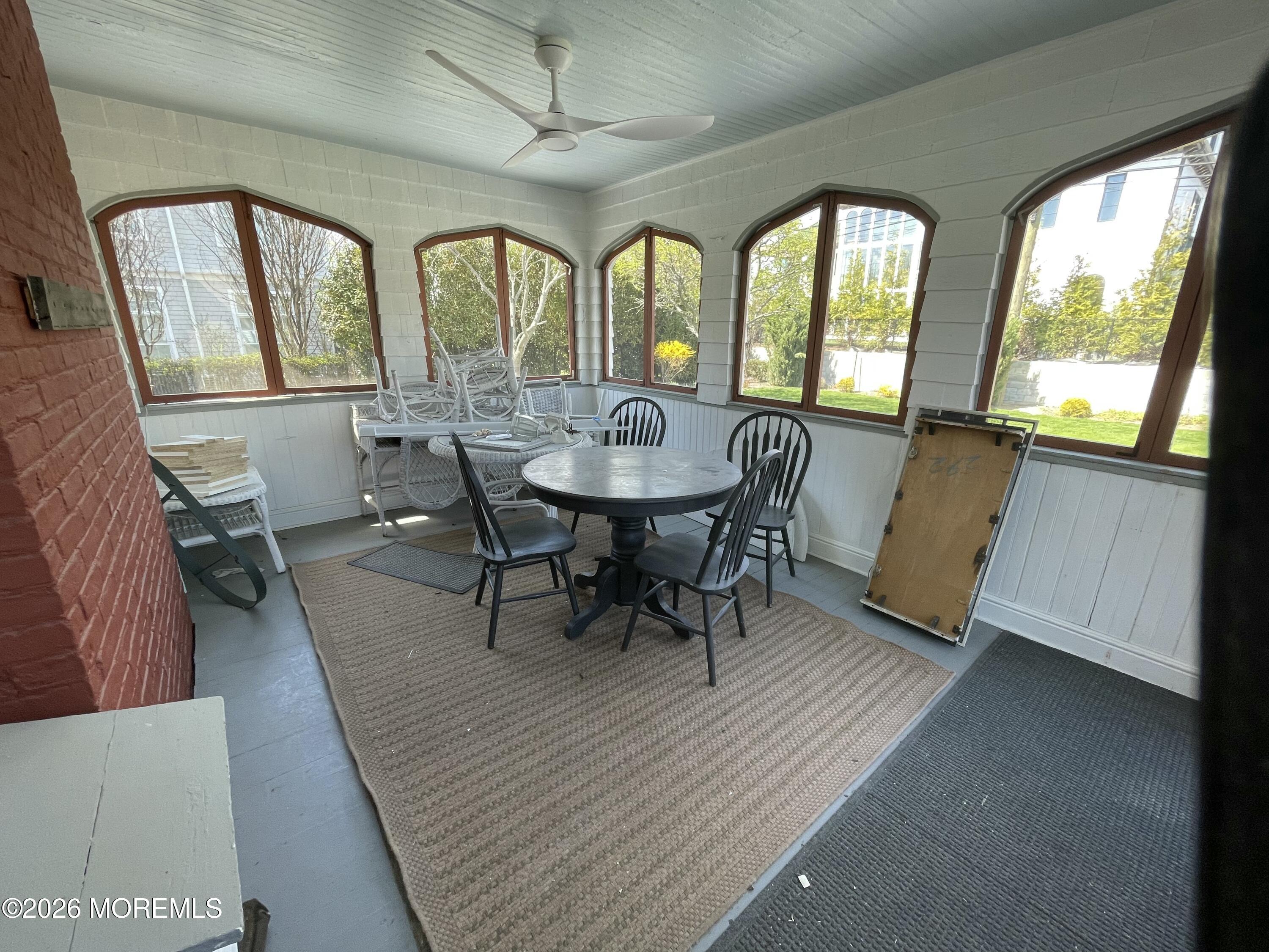 211 Cedar Avenue Allenhurst, NJ 07711 - Photo 17 of 20 a view of a dining room with furniture window and wooden floor