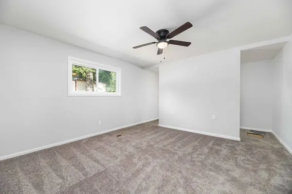 a view of an empty room with a window