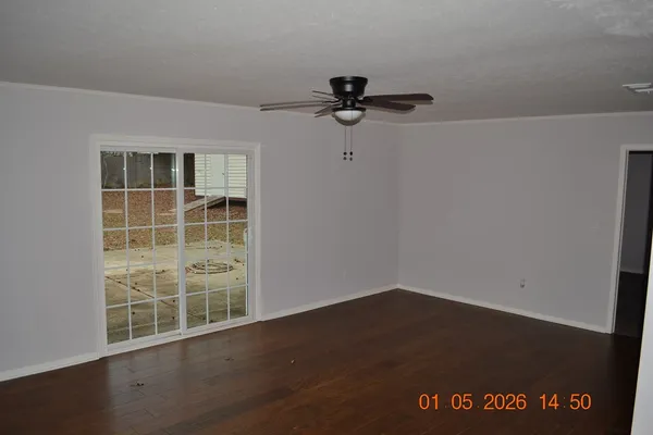 a kitchen with granite countertop cabinets and window
