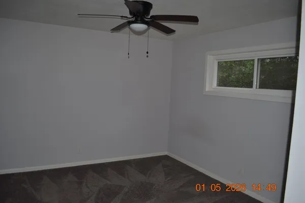 a house with trees in the background