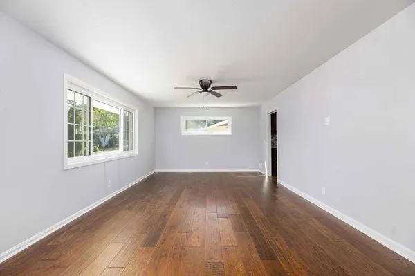 a room with a wooden cabinets and entryway
