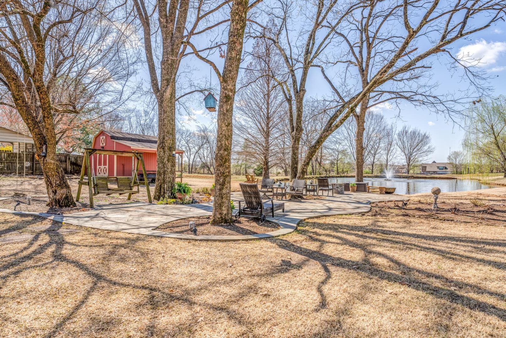 3495 Brunswick Road Bartlett, TN 38133 - Photo 35 of 40 View of yard featuring an outbuilding, fence, and a water view
