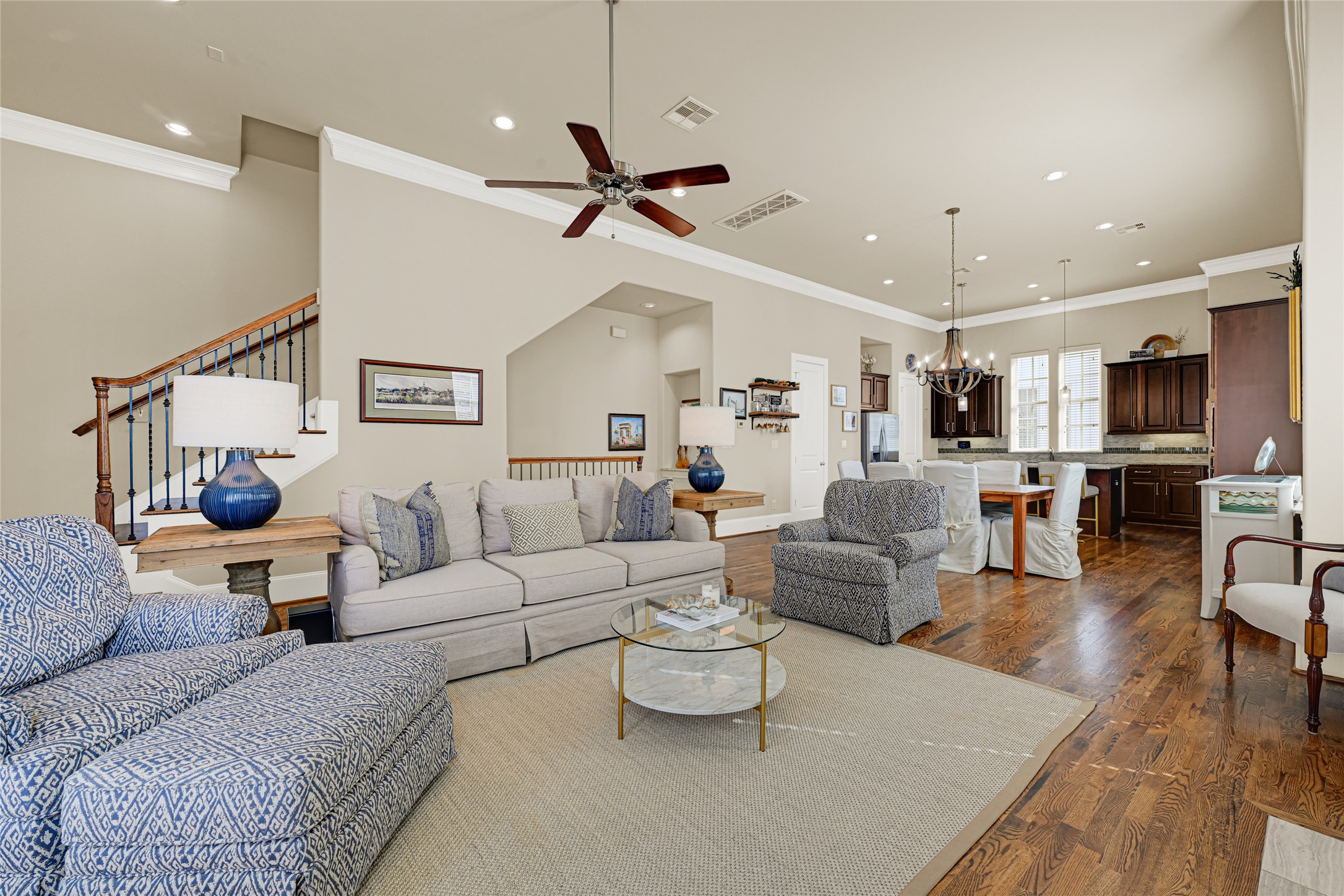 2039 Fannin Station North Houston, TX 77045 - Photo 1 of 25 a living room with furniture kitchen view and a wooden floor