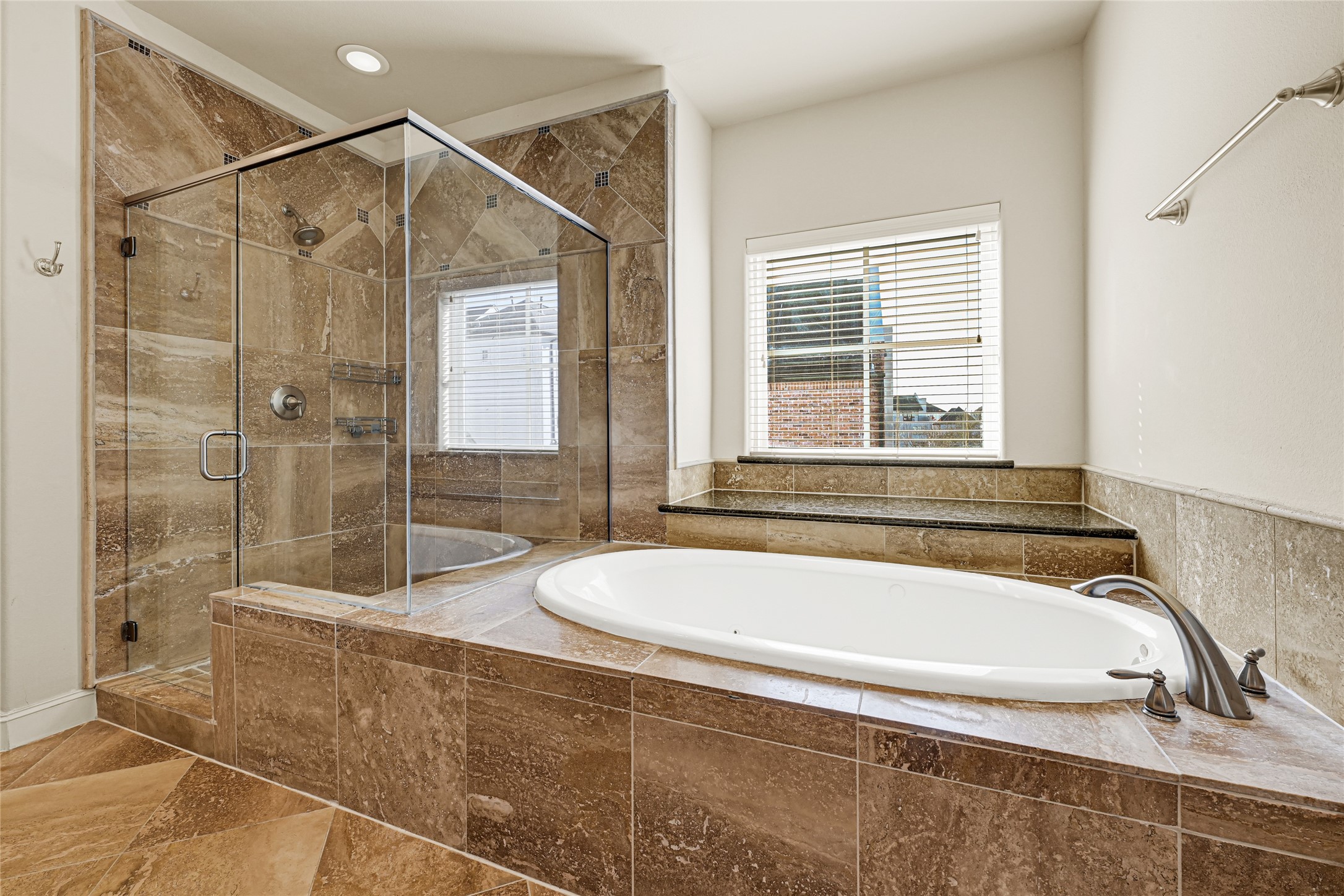 2039 Fannin Station North Houston, TX 77045 - Photo 21 of 25 a bathroom with a tub and a shower