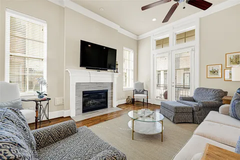 a living room with furniture fireplace and window