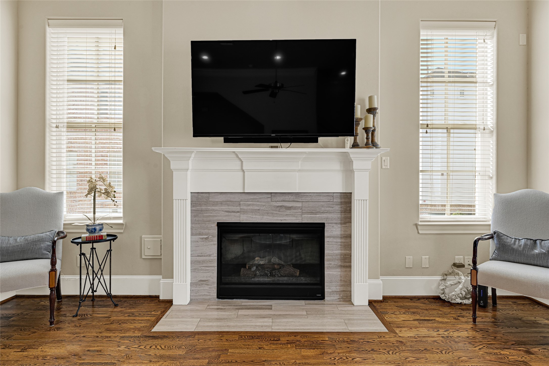 2039 Fannin Station North Houston, TX 77045 - Photo 9 of 25 a living room with a fireplace and a flat screen tv