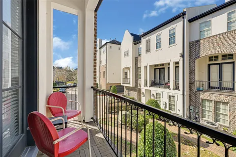 a view of a balcony with chairs