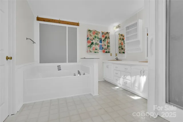 a bathroom with a bathtub and a shower