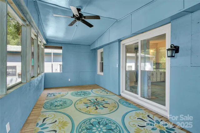a view of a house with yard and a tree