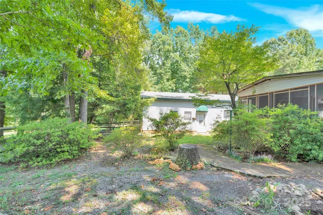 a view of outdoor space with deck and yard