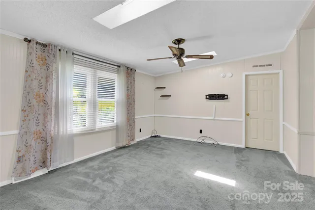 a view of empty room with windows