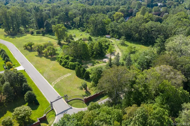 an aerial view of residential house with outdoor space and swimming pool