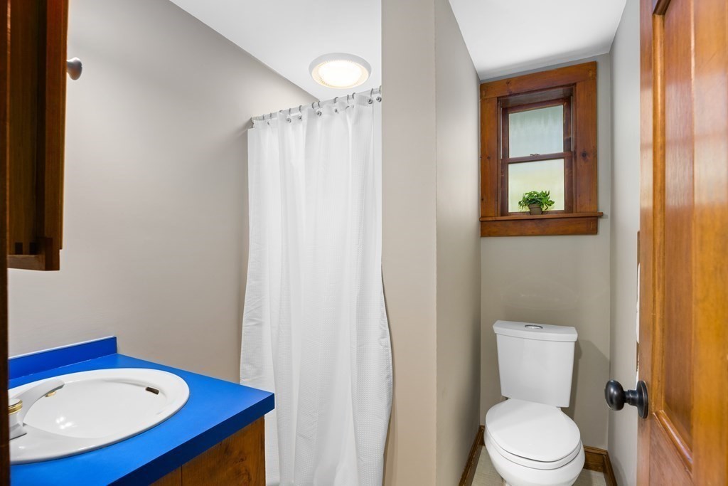 3 Howe Street Ashland, MA 01721 - Photo 15 of 37 a bathroom with a toilet a sink and bathtub