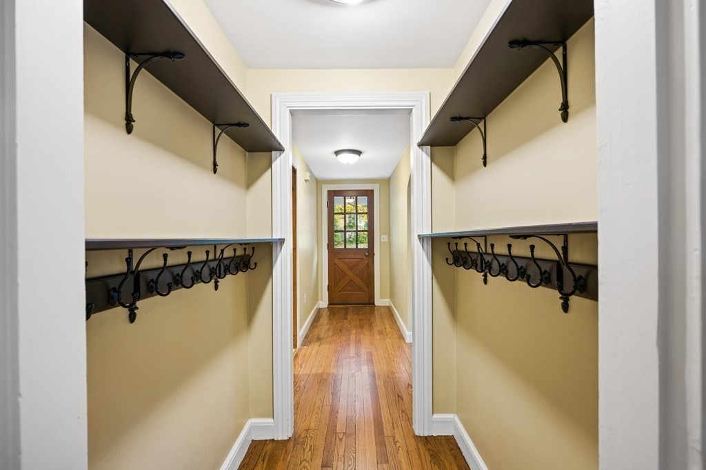 3 Howe Street Ashland, MA 01721 - Photo 16 of 37 a view of a hallway with wooden floor and staircase