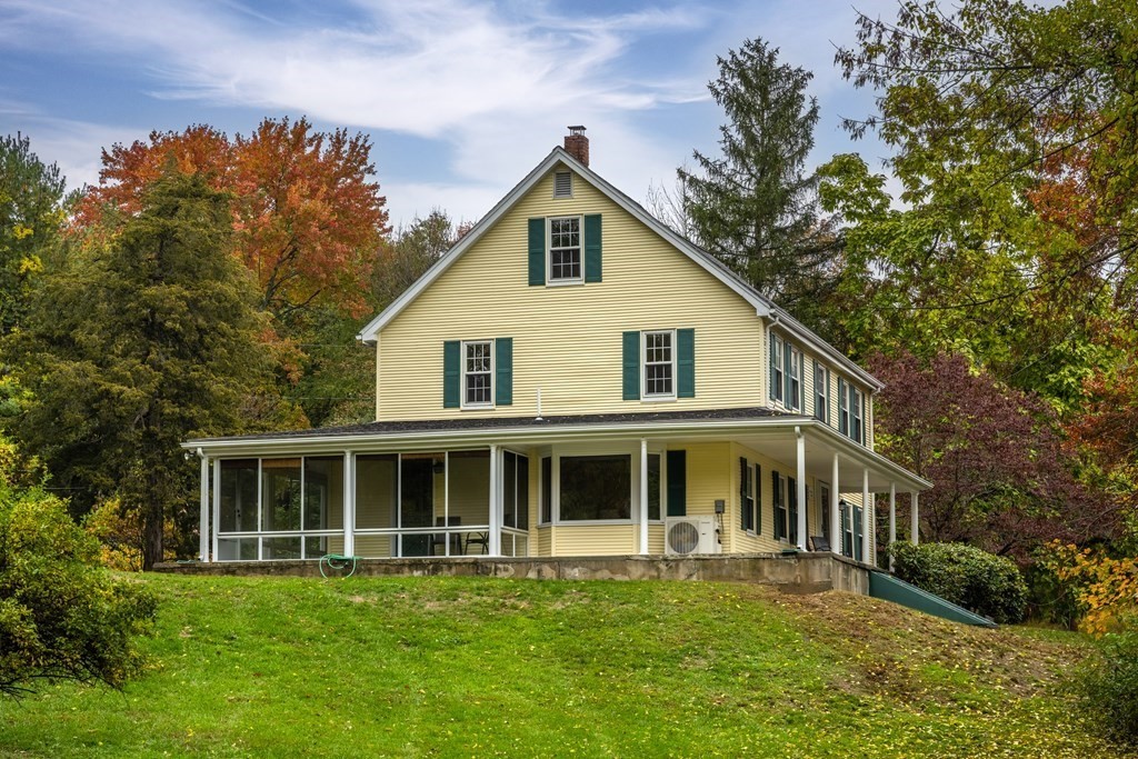 3 Howe Street Ashland, MA 01721 - Photo 2 of 37 a front view of a house with a garden