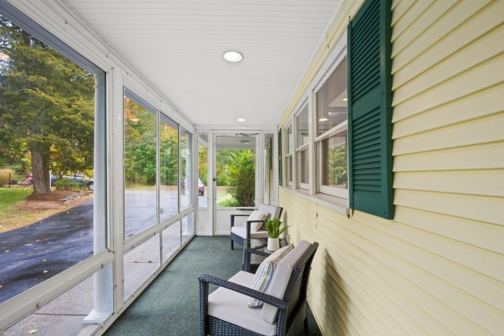3 Howe Street Ashland, MA 01721 - Photo 27 of 37 a balcony with furniture and wooden floor