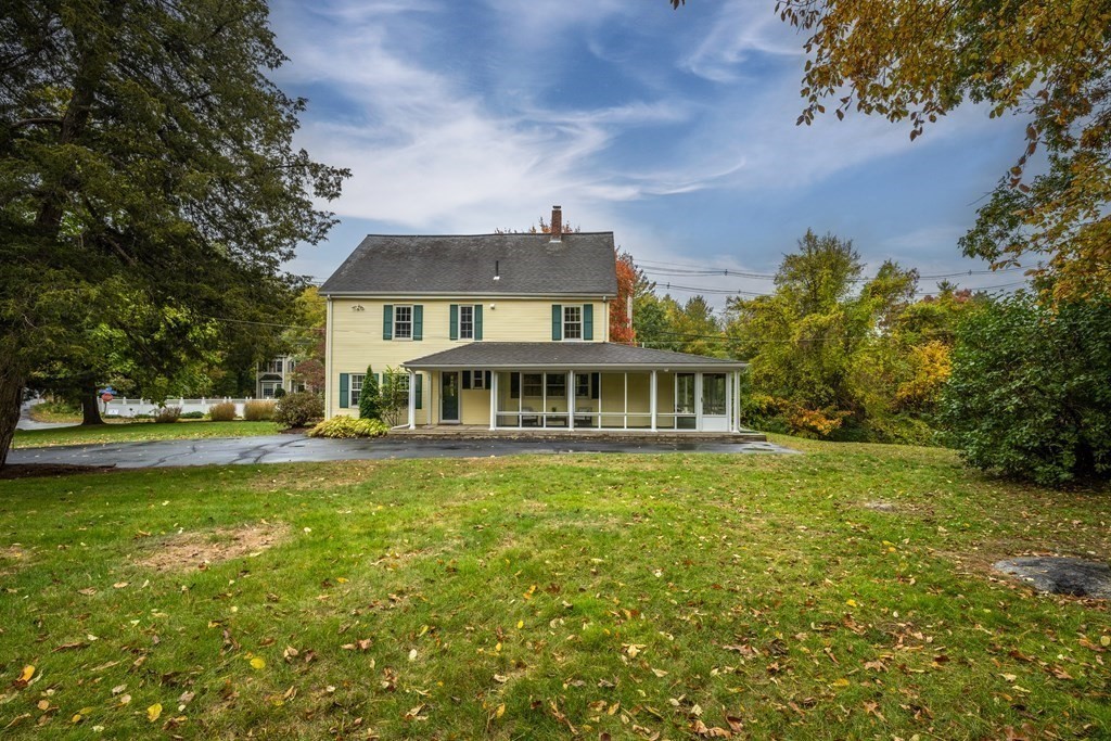 3 Howe Street Ashland, MA 01721 - Photo 36 of 37 a view of a house with a big yard and large trees