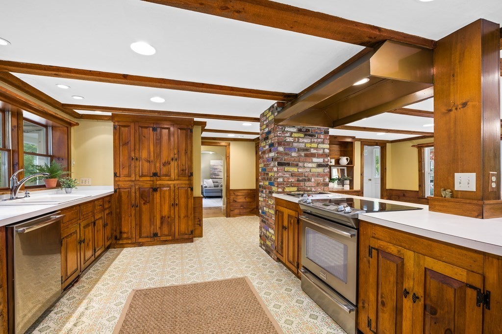 3 Howe Street Ashland, MA 01721 - Photo 5 of 37 a kitchen with stainless steel appliances granite countertop sink stove and refrigerator