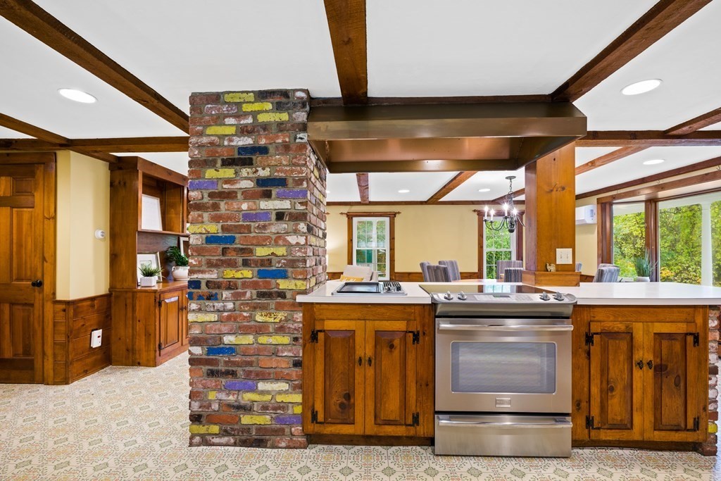 3 Howe Street Ashland, MA 01721 - Photo 7 of 37 a kitchen with a stove and a refrigerator