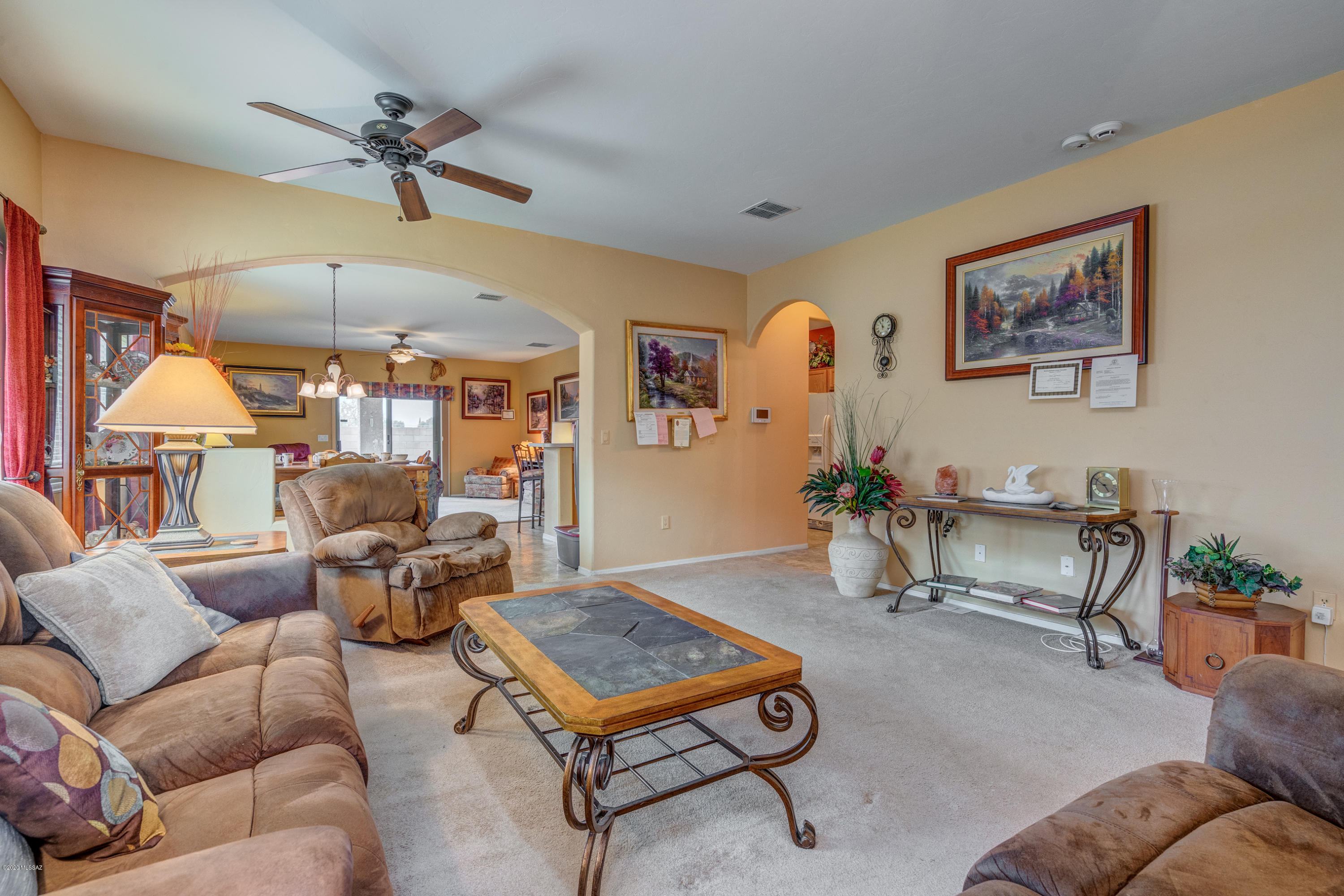 3640 East Northern Dancer Road Tucson, AZ 85739 - Photo 10 of 47 a living room with furniture and a wooden floor
