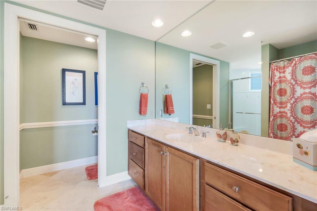 275 Indies Way, Unit 605 Naples, FL 34110 - Photo 22 of 41 Bathroom featuring tile floors and vanity