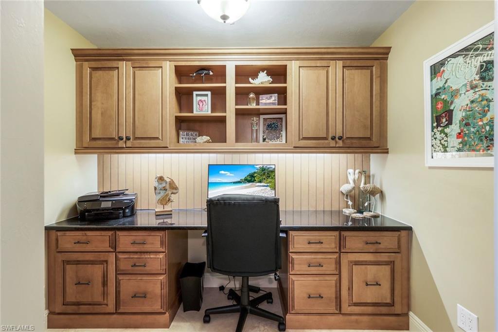 275 Indies Way, Unit 605 Naples, FL 34110 - Photo 26 of 41 Office area featuring built in desk and carpet floors