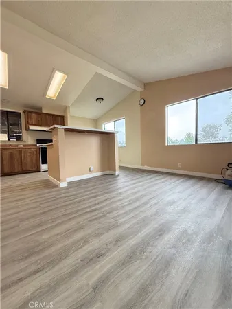 a view of a kitchen with a sink cabinets and a wooden floor