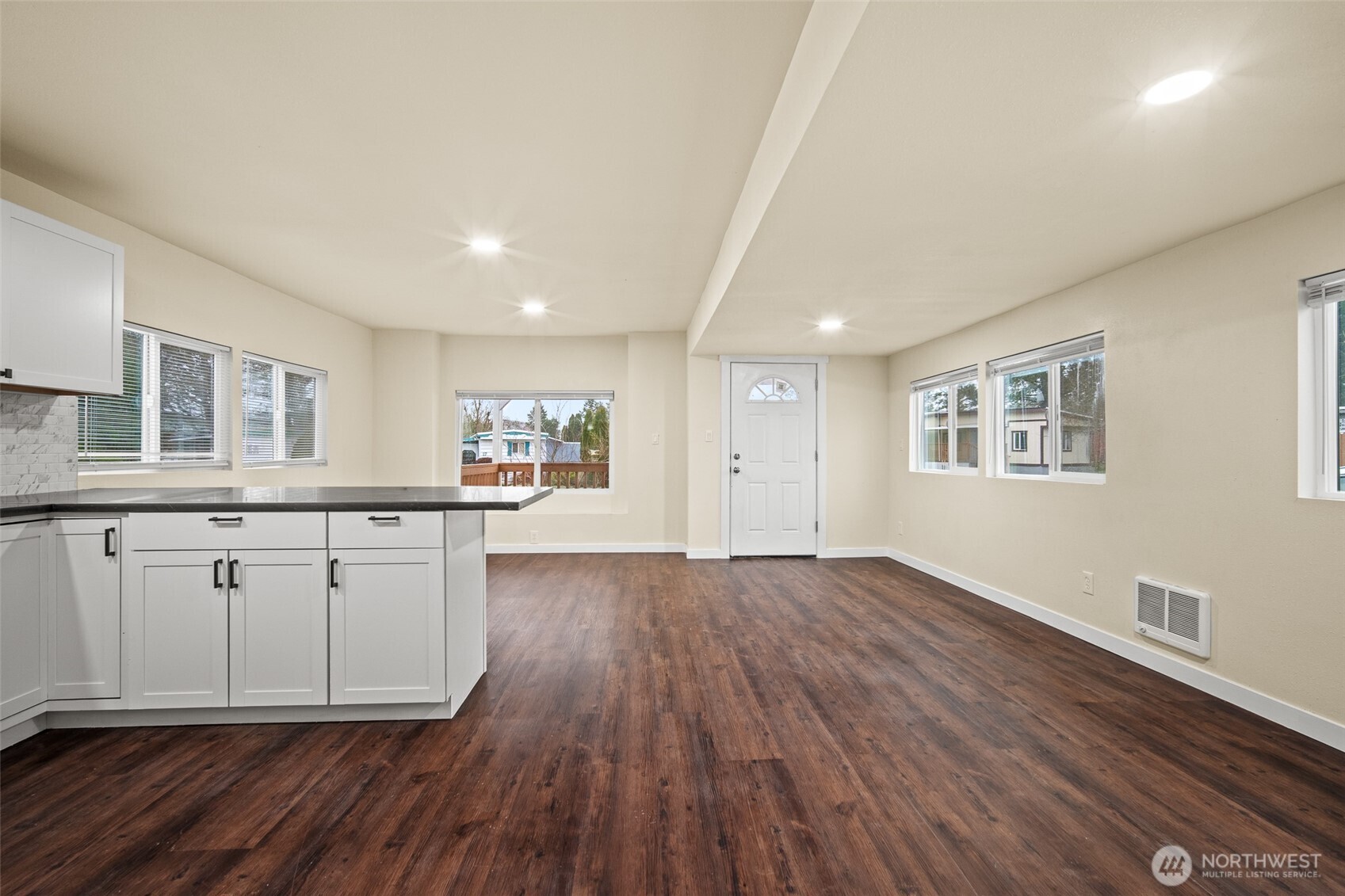 2392 Douglas Road, Unit 4 Ferndale, WA 98248 - Photo 11 of 39 a view of a kitchen with wooden floor and a window