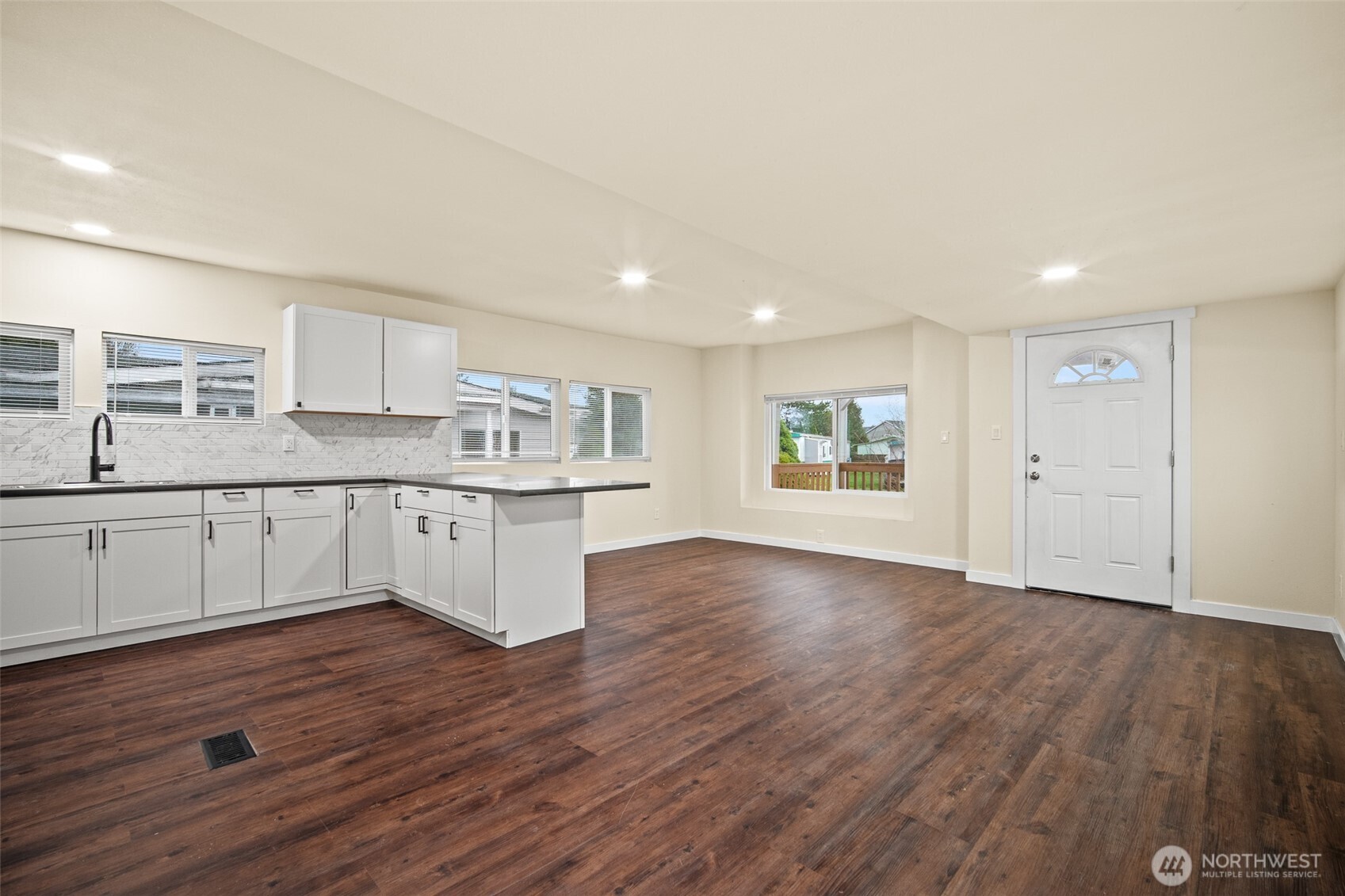 2392 Douglas Road, Unit 4 Ferndale, WA 98248 - Photo 12 of 39 a large kitchen with a wooden floor and window