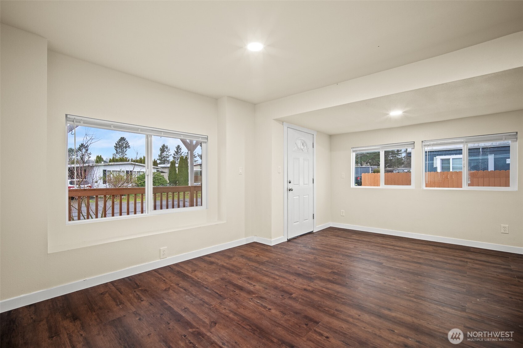 2392 Douglas Road, Unit 4 Ferndale, WA 98248 - Photo 13 of 39 a view of an empty room with wooden floor and a window
